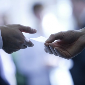 Hands with business card